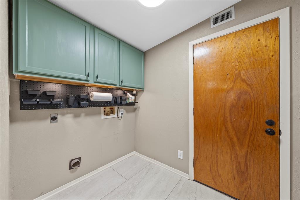 3924 North 30th Street Waco, TX 76708 - Photo 15 of 33 Laundry room is adjacent to the kitchen, connects to garage.