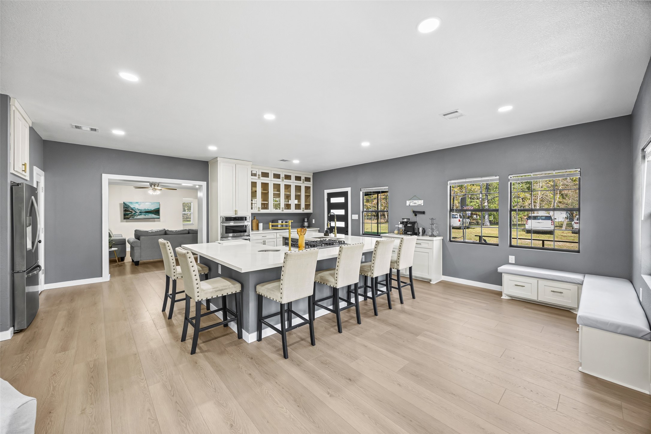 15080 Usher Lane Splendora, TX 77372 - Photo 11 of 44 a dining room with stainless steel appliances furniture and wooden floor
