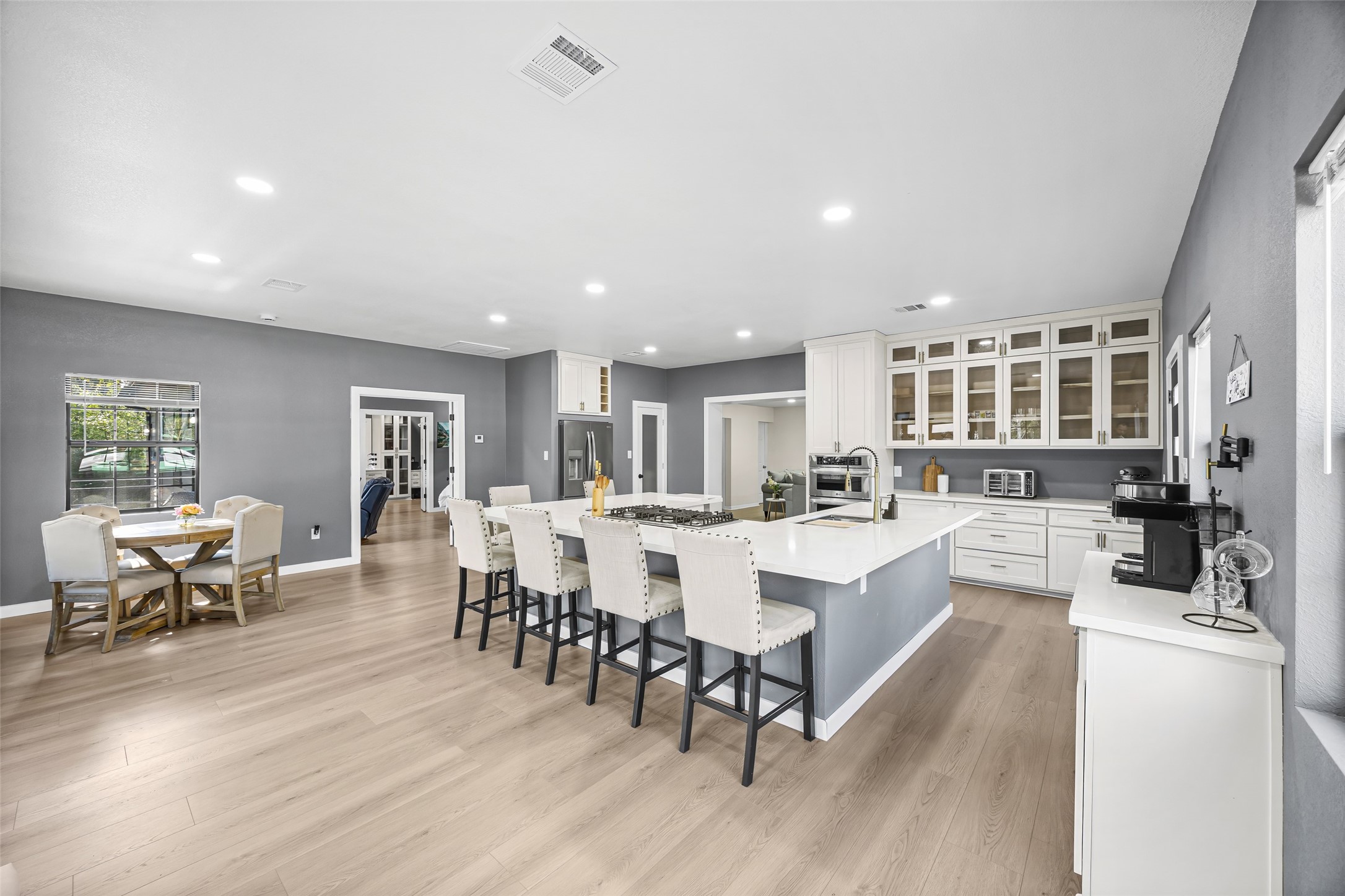15080 Usher Lane Splendora, TX 77372 - Photo 13 of 44 a large kitchen with a table and chairs in it