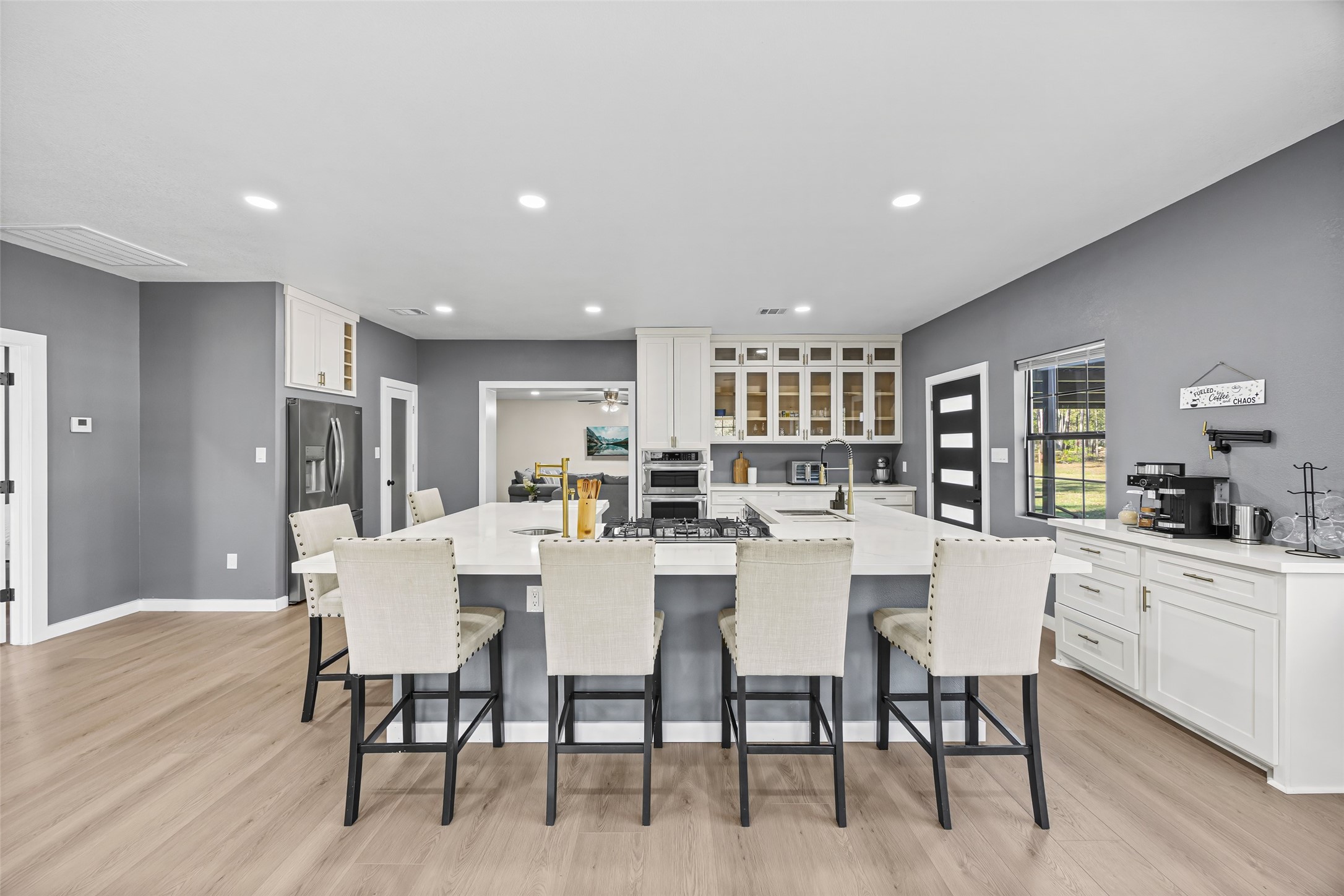 15080 Usher Lane Splendora, TX 77372 - Photo 17 of 44 a dining room with stainless steel appliances a table and chairs