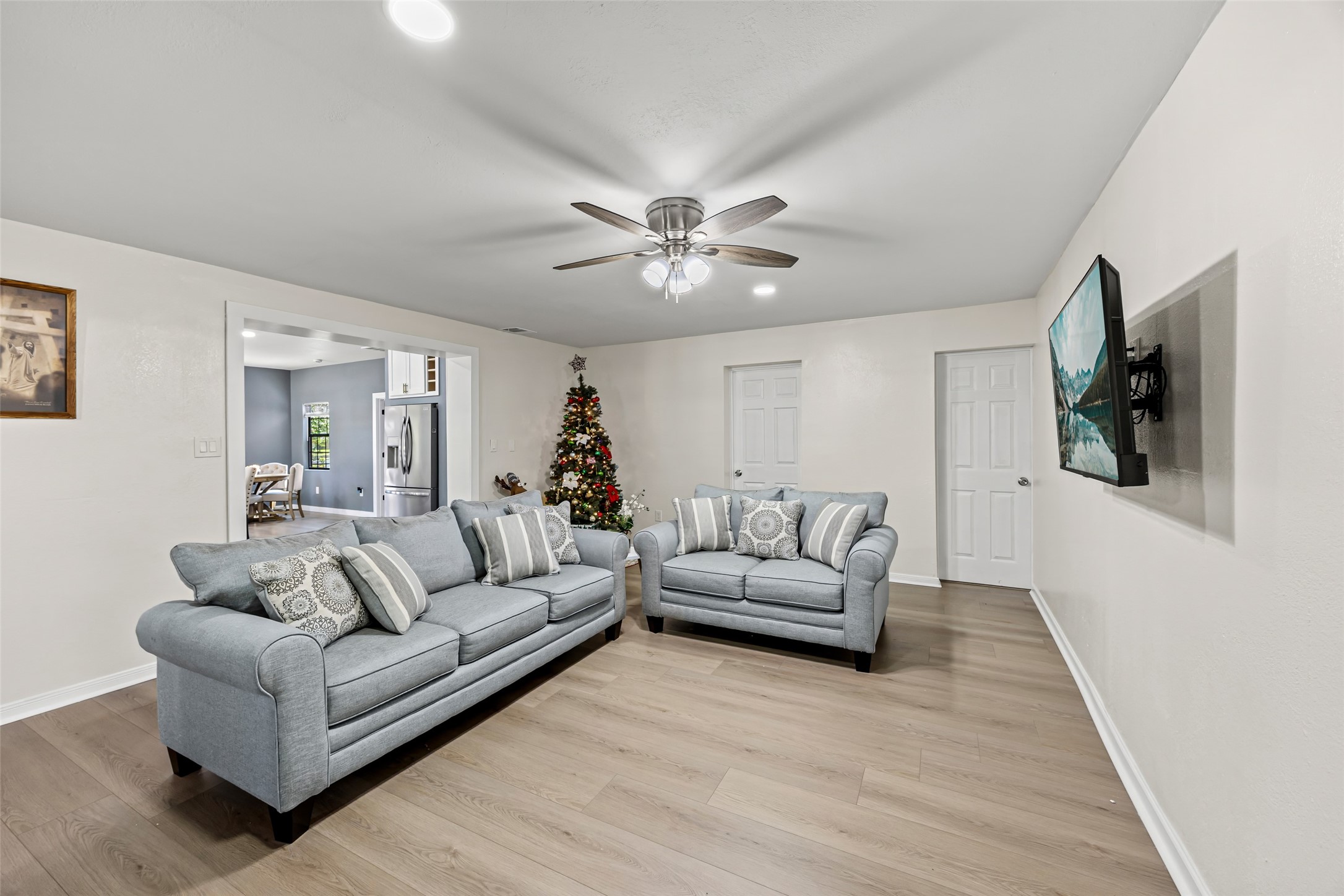 15080 Usher Lane Splendora, TX 77372 - Photo 36 of 44 a living room with furniture and a flat screen tv
