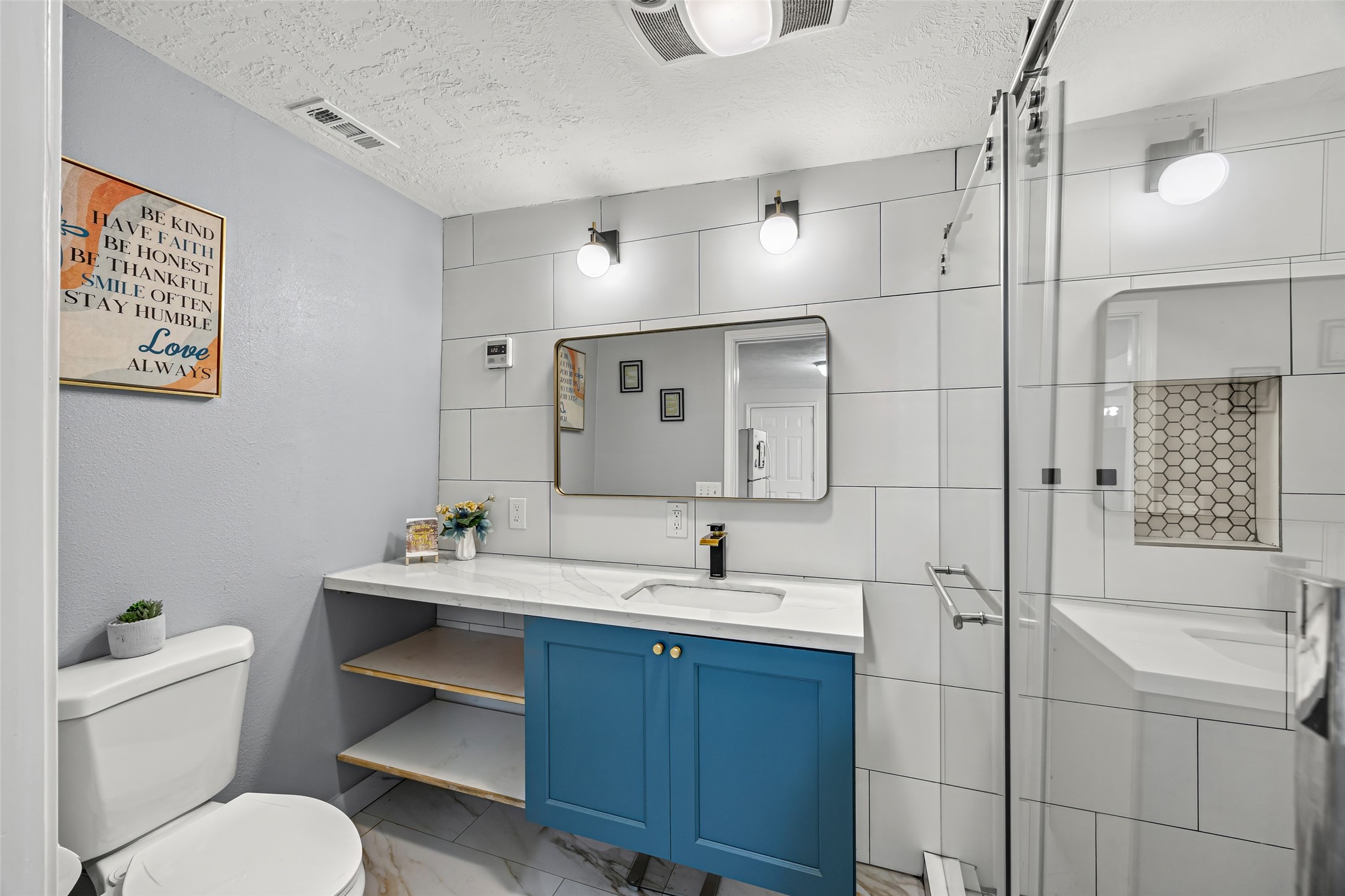 15080 Usher Lane Splendora, TX 77372 - Photo 41 of 44 a bathroom with a toilet sink and shower