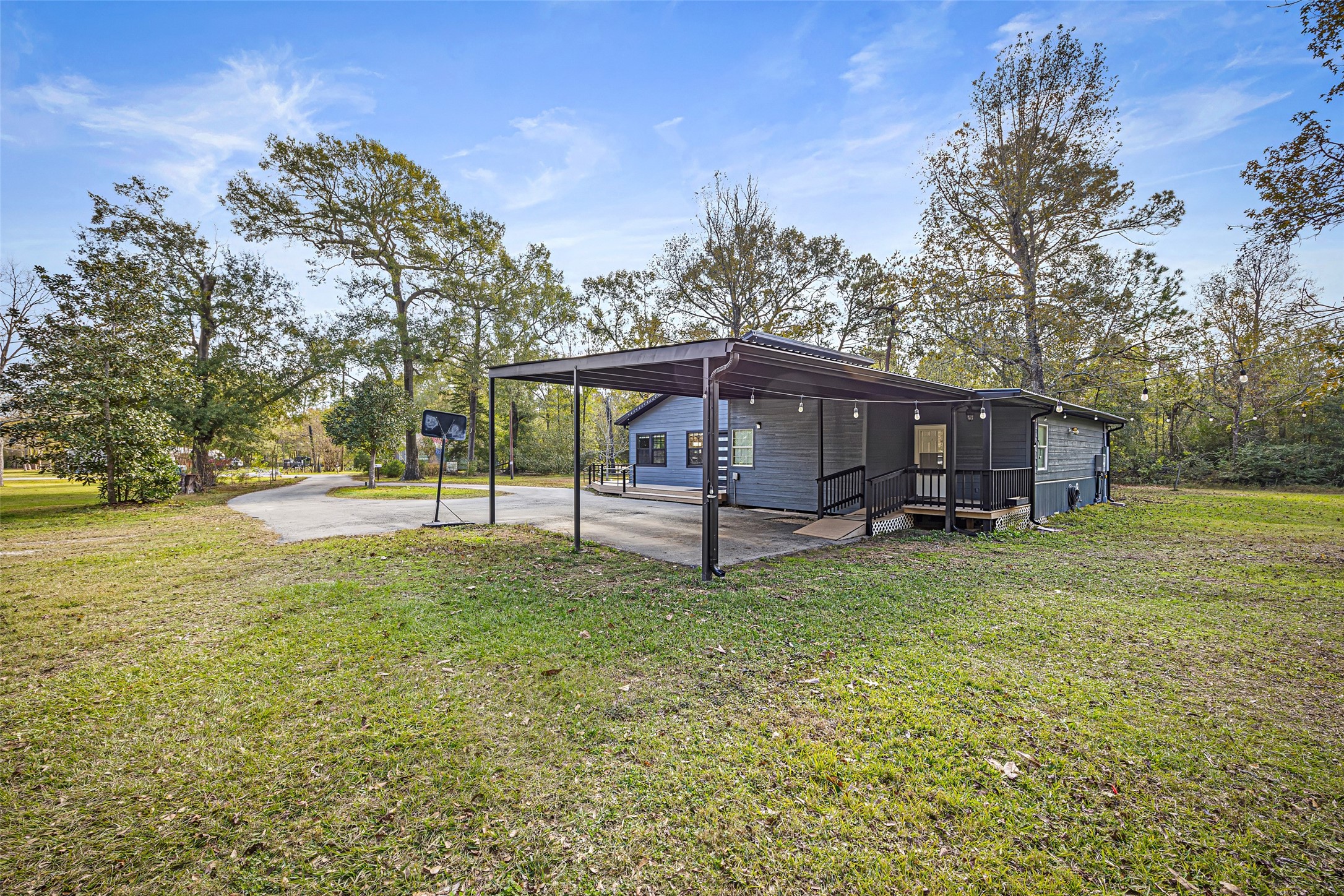 15080 Usher Lane Splendora, TX 77372 - Photo 43 of 44 a view of a house with backyard and a tree