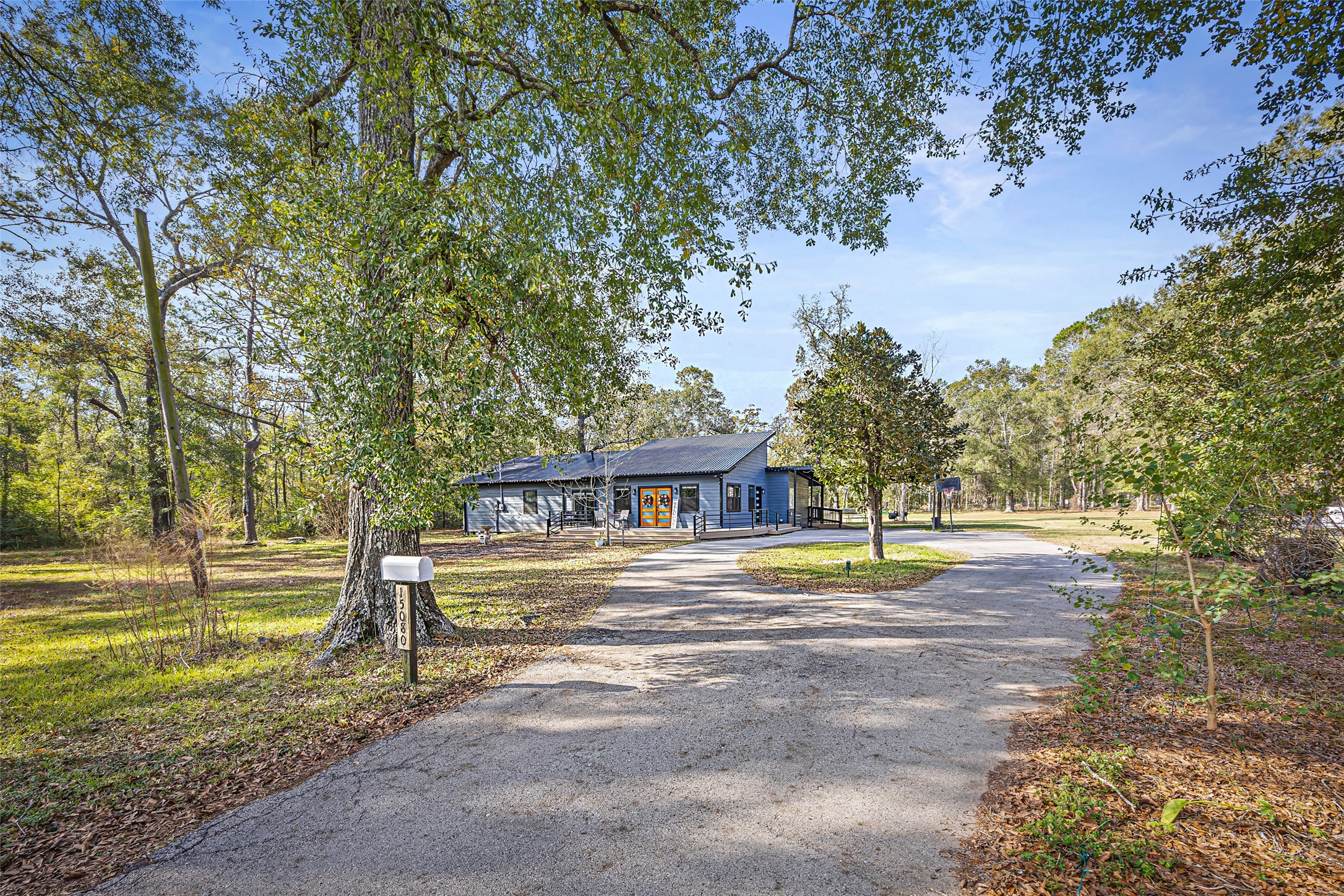 15080 Usher Lane Splendora, TX 77372 - Photo 5 of 44 a front view of a house with a yard