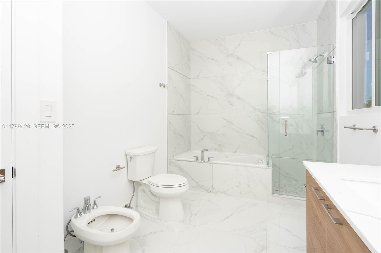 900 Southwest 24th Road Miami, FL 33129 - Photo 24 of 27 a bathroom with a toilet a sink and bathtub