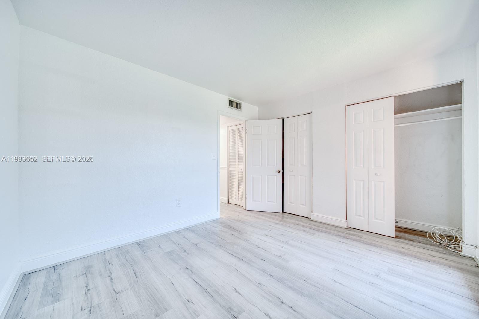 9459 Southwest 76th Street, Unit R5 Miami, FL 33173 - Photo 18 of 33 a view of an empty room
