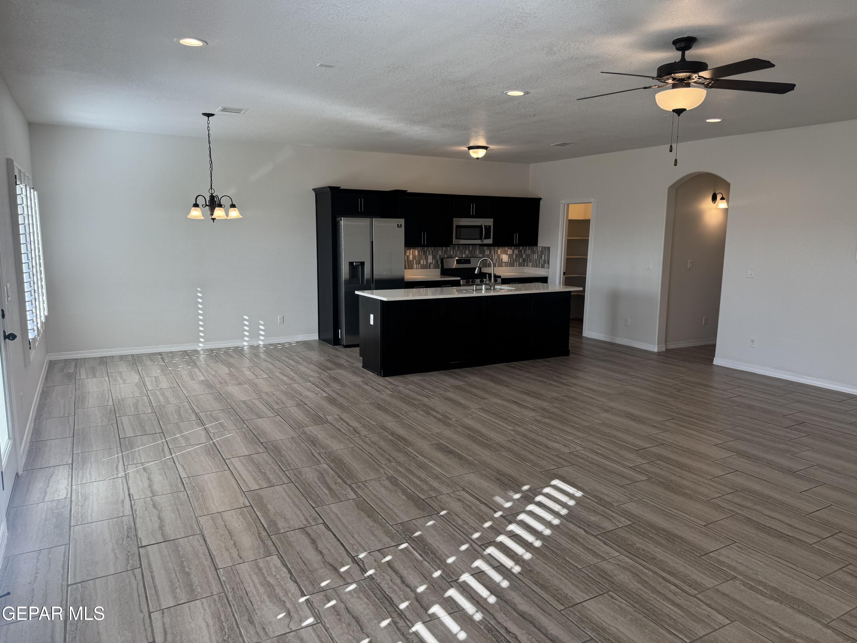 412 Indigo Court El Paso, TX 79932 - Photo 11 of 53 a living room with hard wood flooring and furniture