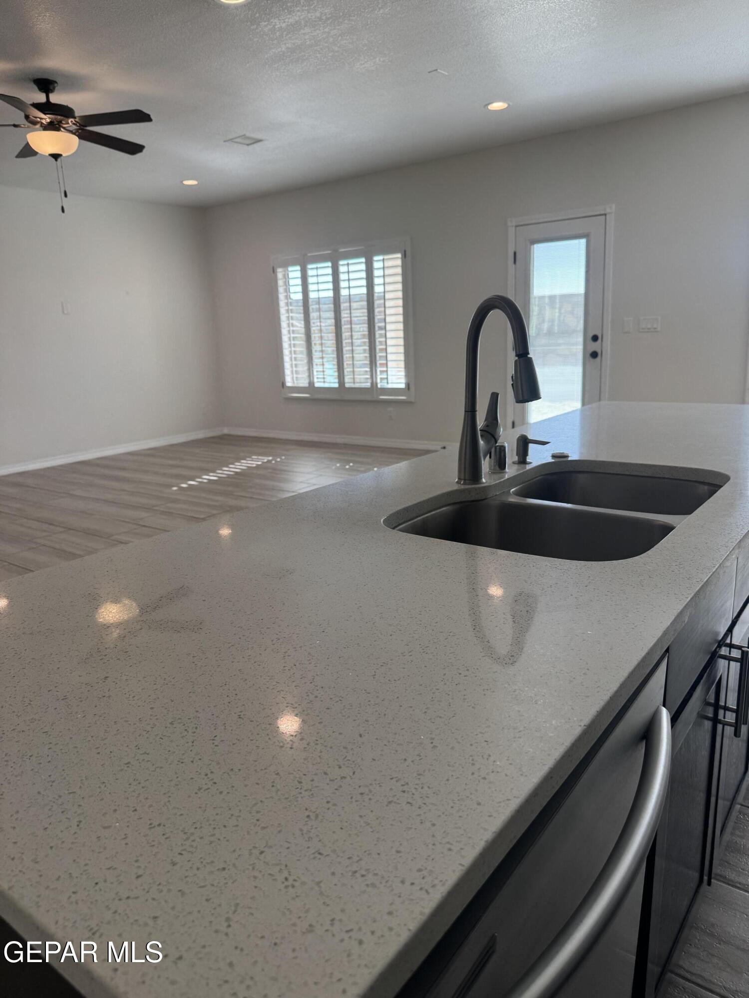 412 Indigo Court El Paso, TX 79932 - Photo 23 of 53 a close view of a sink a faucet and appliance in the room