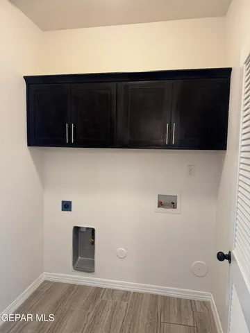 a kitchen with stainless steel appliances granite countertop cabinets and window