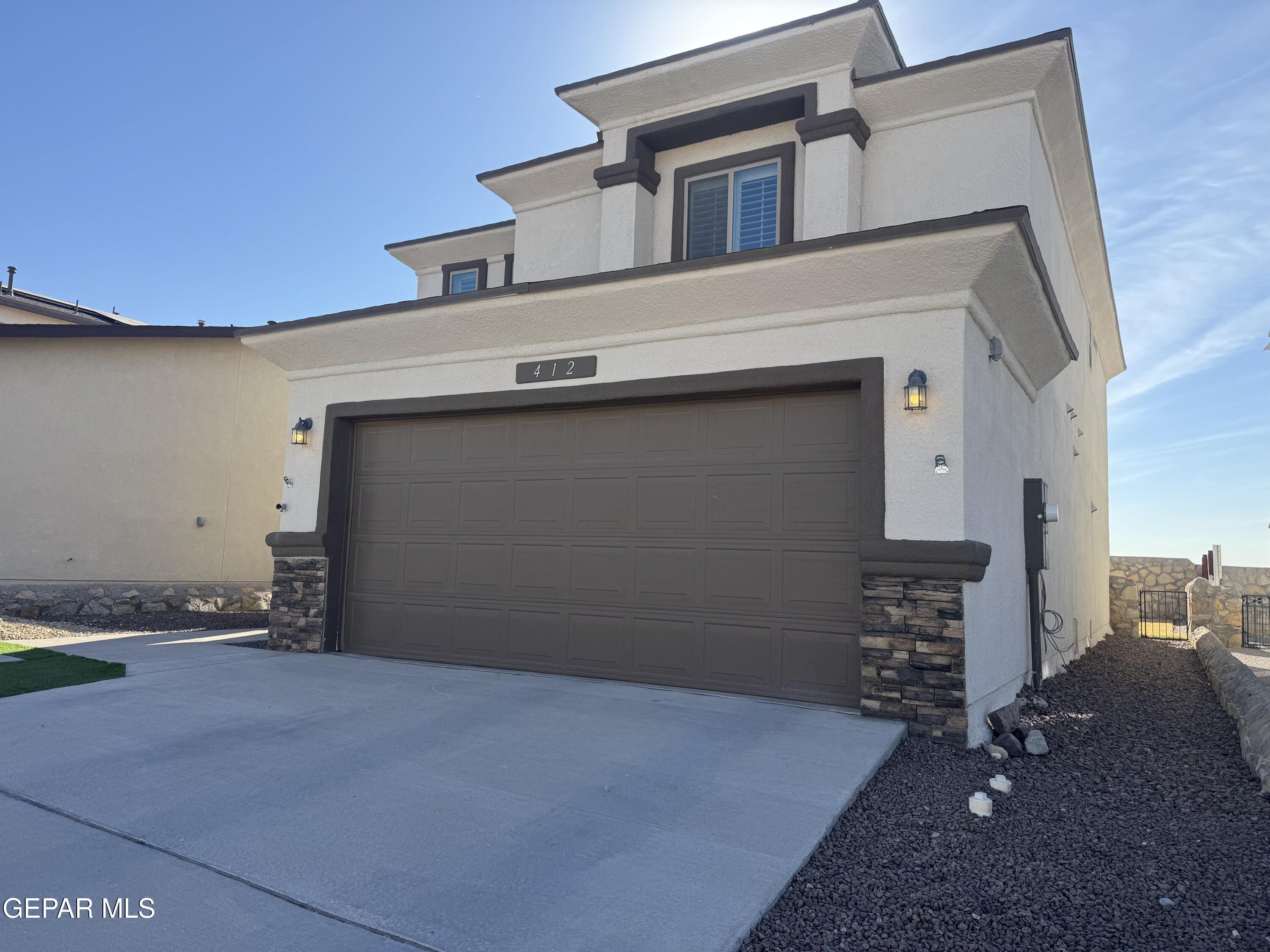 412 Indigo Court El Paso, TX 79932 - Photo 3 of 53 a view of garage and yard
