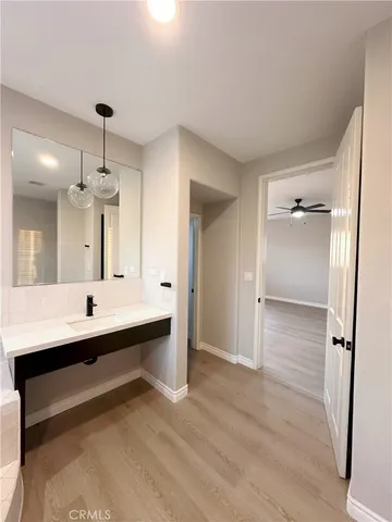 a bathroom with a double vanity sink mirror and shower