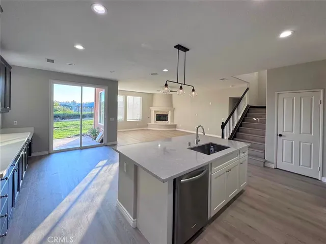 a kitchen with a sink and stove