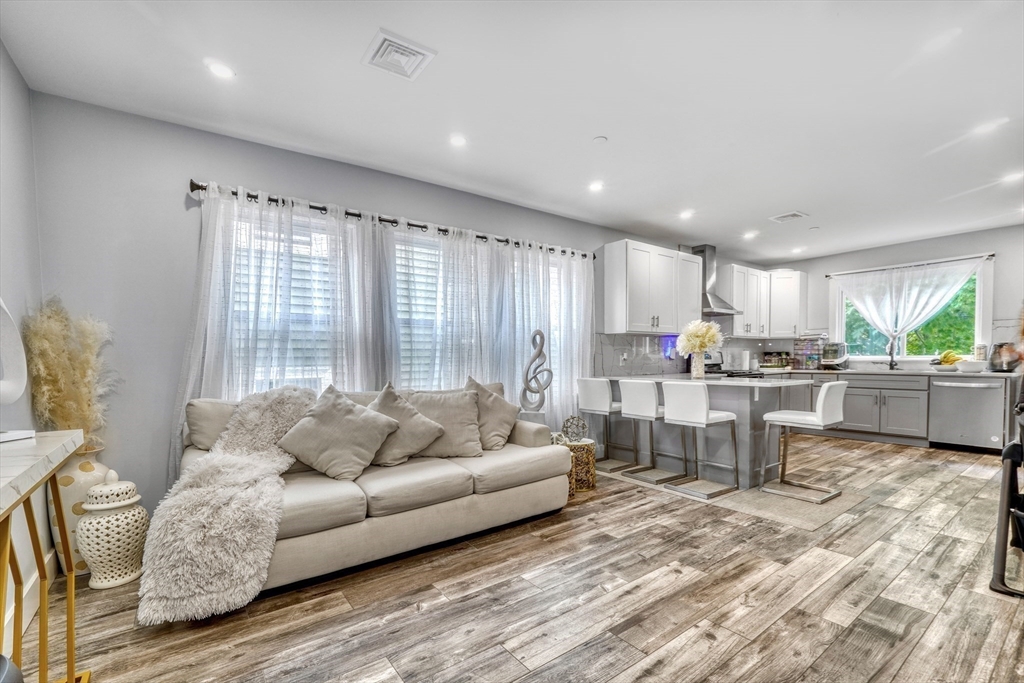 61 Shepton Street Boston, MA 02124 - Photo 15 of 38 a living room with furniture and a large window