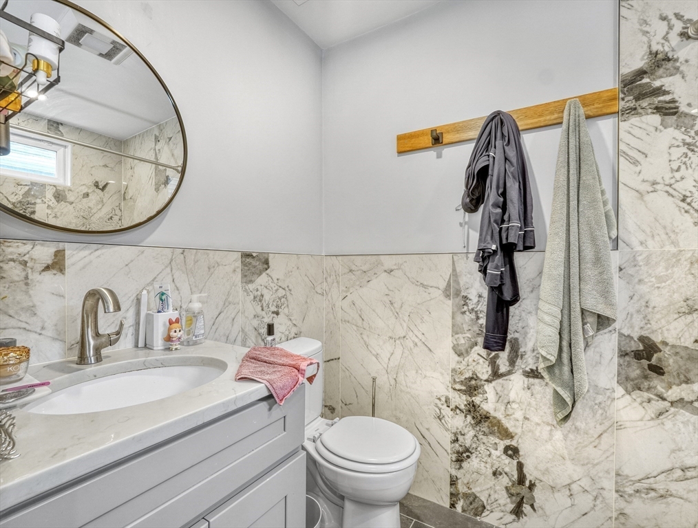61 Shepton Street Boston, MA 02124 - Photo 9 of 38 a bathroom with a sink and a mirror