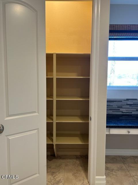 5200 Breakers Way Oxnard, CA 93035 - Photo 15 of 75 a view of walk in closet with empty racks