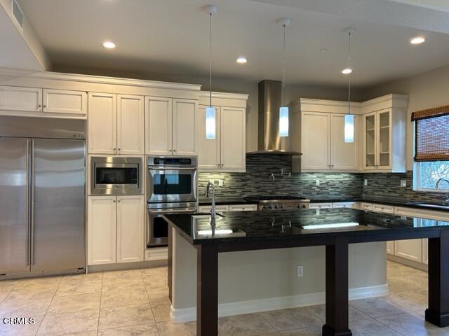 5200 Breakers Way Oxnard, CA 93035 - Photo 16 of 75 a kitchen with stainless steel appliances granite countertop a stove a sink and a refrigerator
