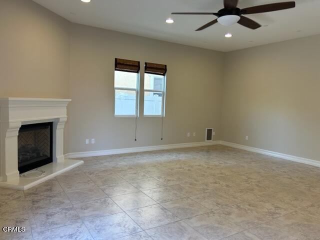 5200 Breakers Way Oxnard, CA 93035 - Photo 24 of 75 an empty room with a fireplace and windows