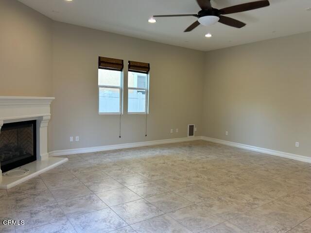 5200 Breakers Way Oxnard, CA 93035 - Photo 25 of 75 an empty room with a fireplace and windows