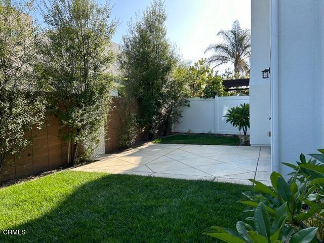 5200 Breakers Way Oxnard, CA 93035 - Photo 33 of 75 a view of a yard with plants and a tree