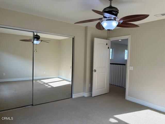 5200 Breakers Way Oxnard, CA 93035 - Photo 67 of 75 a view of a room with a mirror and a ceiling fan