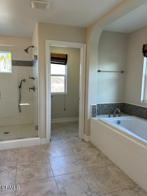 5200 Breakers Way Oxnard, CA 93035 - Photo 73 of 75 a bathroom with a bathtub and a shower