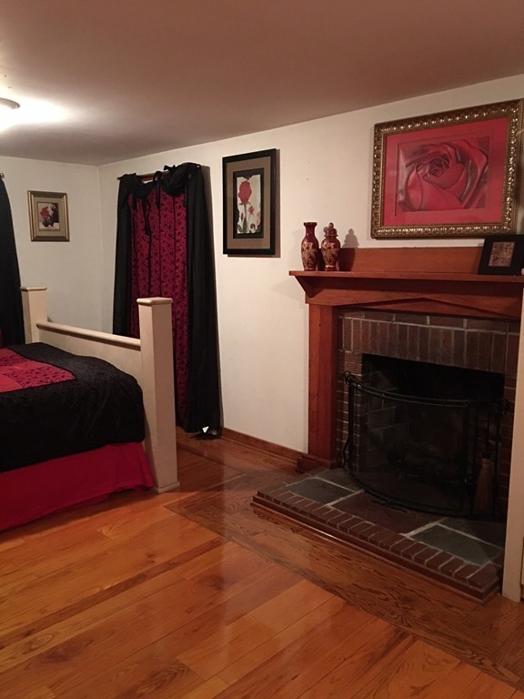 33 Strowbridge Road Northfield, MA 01360 - Photo 12 of 19 a bedroom with a bed and a fireplace