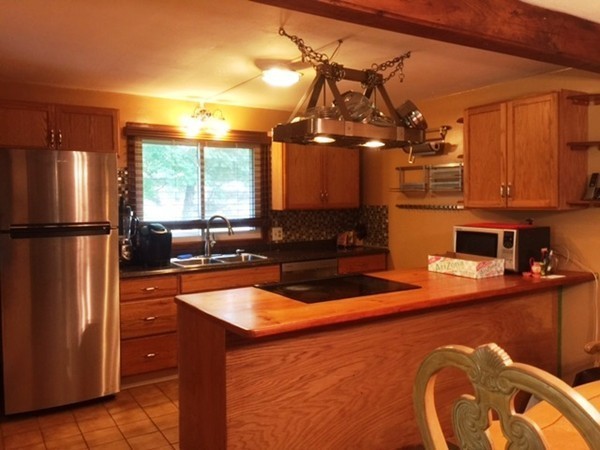 33 Strowbridge Road Northfield, MA 01360 - Photo 3 of 19 a kitchen with stainless steel appliances granite countertop a sink a stove and a refrigerator