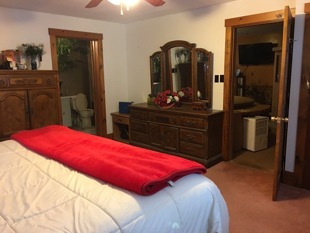 33 Strowbridge Road Northfield, MA 01360 - Photo 8 of 19 a bedroom with a bed and a dresser