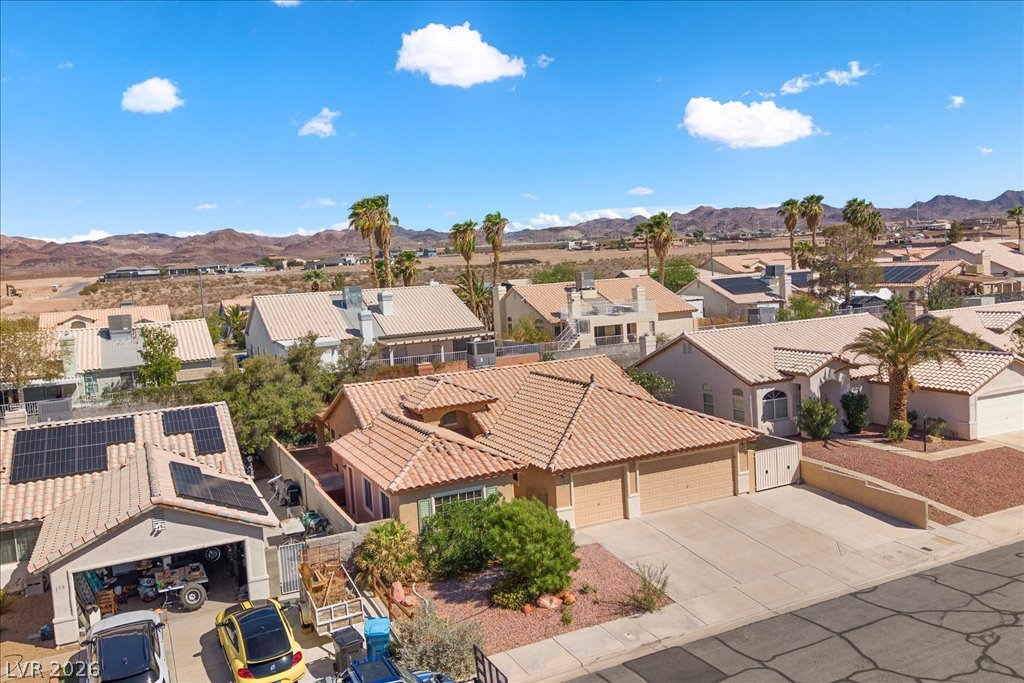 120 Ringlore Road Henderson, NV 89015 - Photo 46 of 58 Scenic mountain backdrops frame a peaceful residential neighborhood under blue skies.