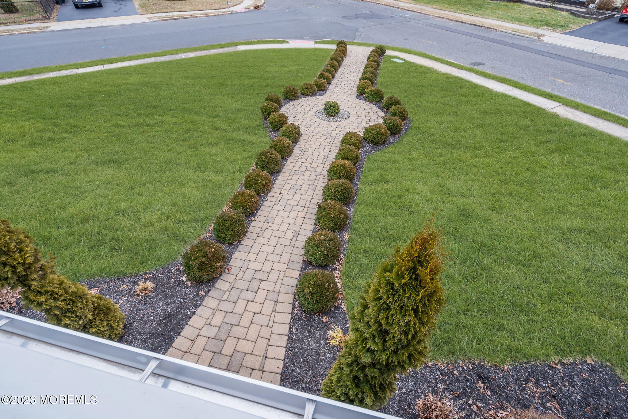 26 North Westfield Road Howell, NJ 07731 - Photo 34 of 59 a view of a yard with an umbrella