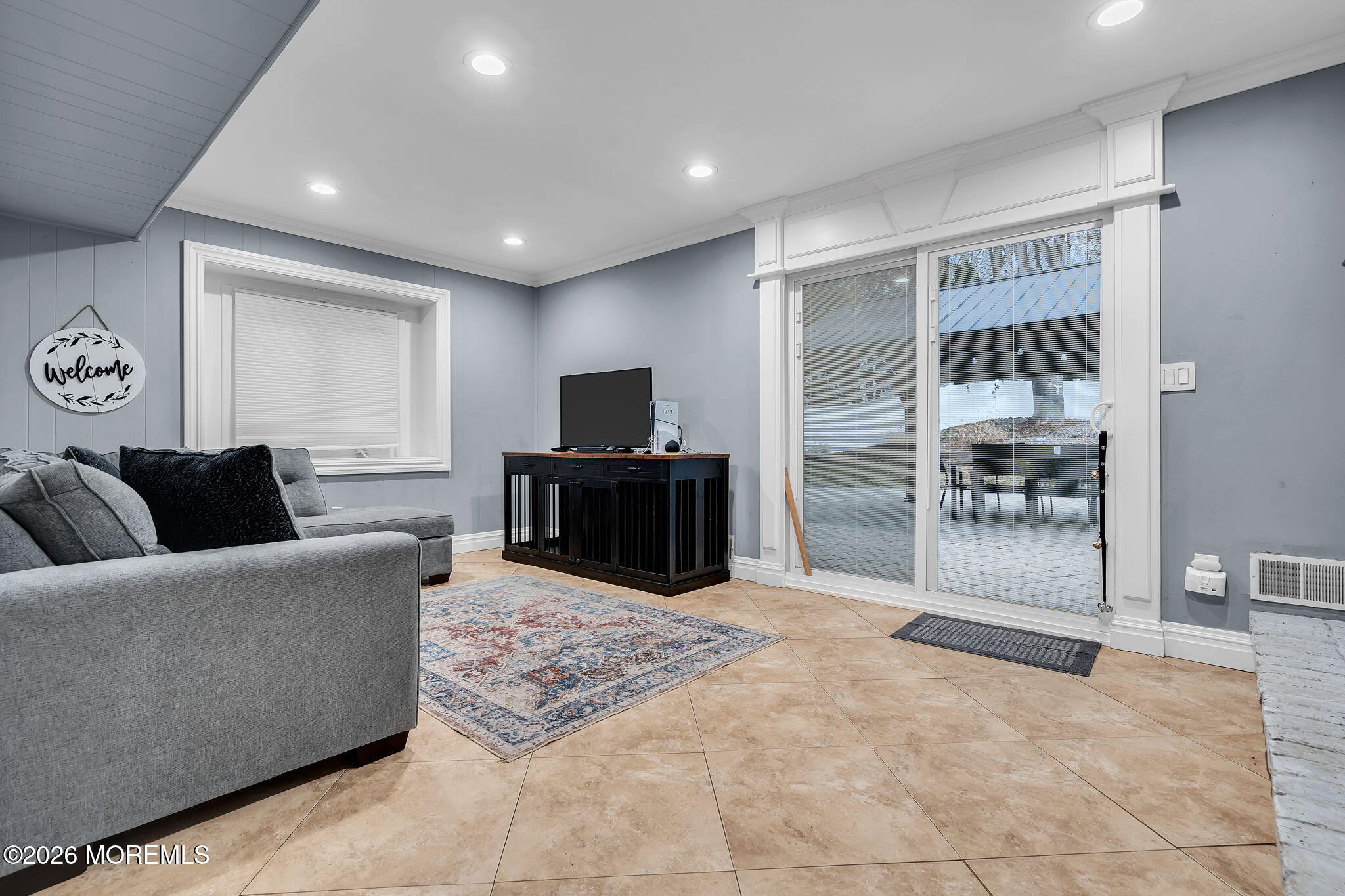 26 North Westfield Road Howell, NJ 07731 - Photo 36 of 59 a living room with furniture and a flat screen tv