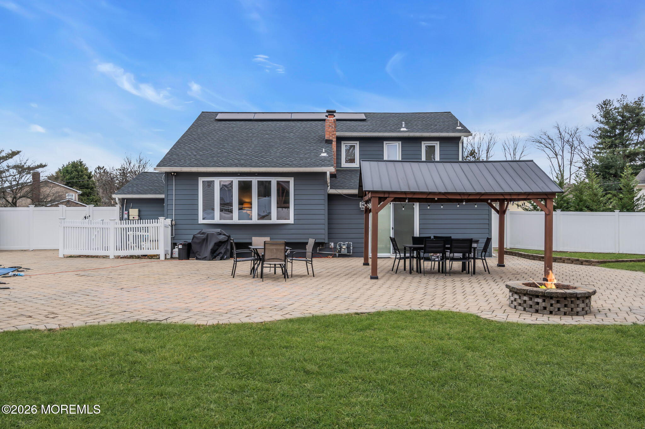 26 North Westfield Road Howell, NJ 07731 - Photo 52 of 59 a view of a house with patio and a yard
