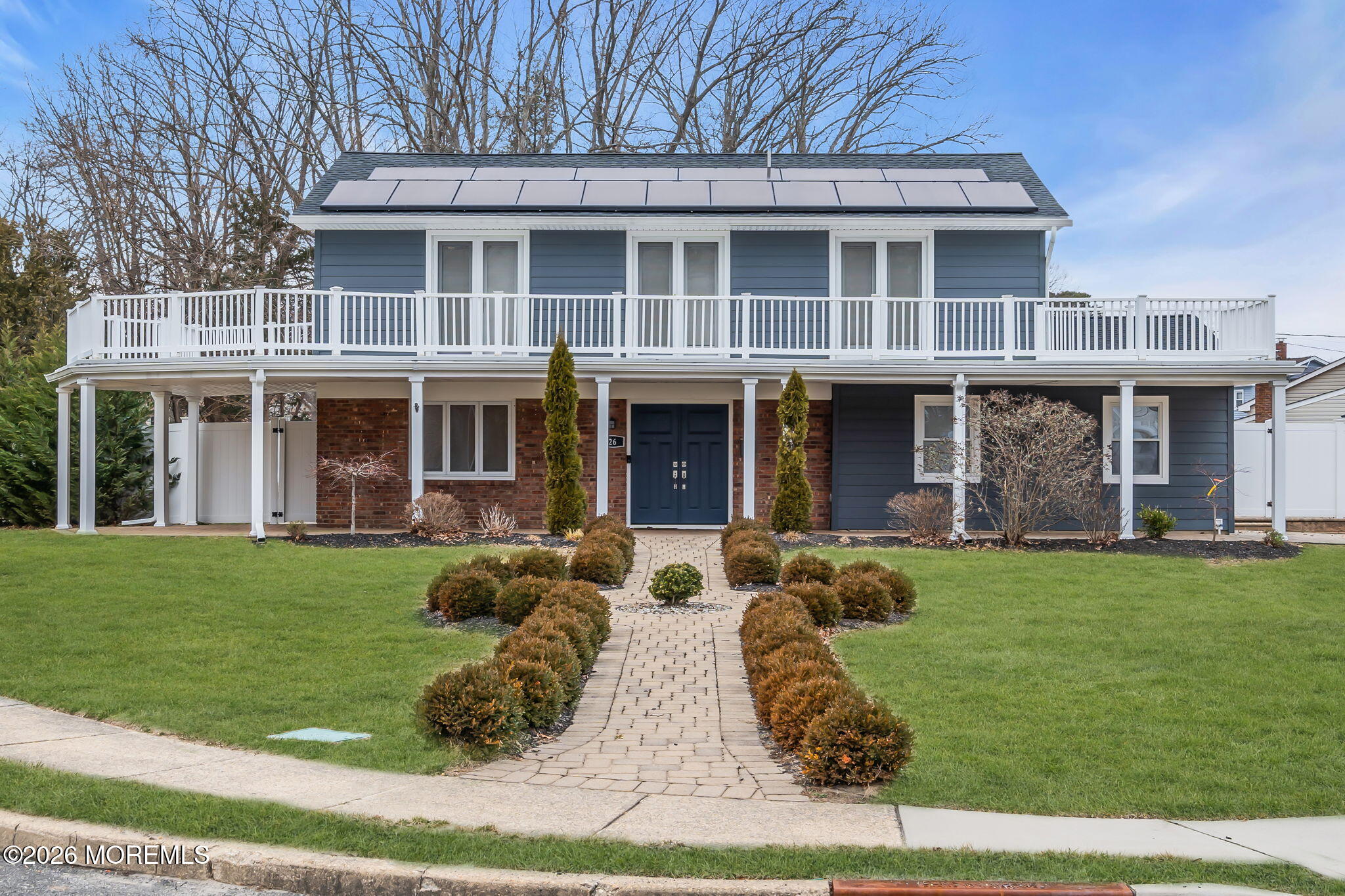 26 North Westfield Road Howell, NJ 07731 - Photo 59 of 59 front view of a brick house with a yard