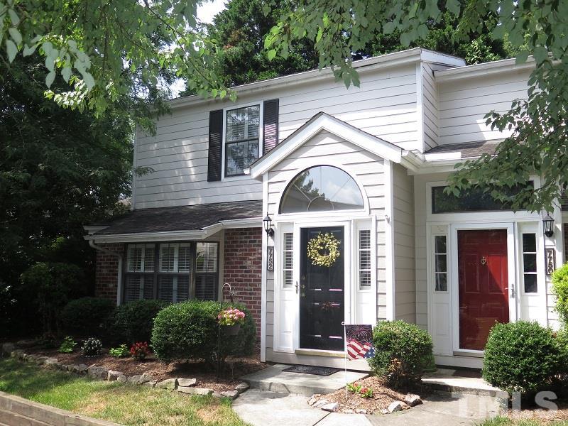 7752 Falcon Rest Circle, Unit 7752 Raleigh, NC 27615 - Photo 1 of 17 a front view of a house with garden