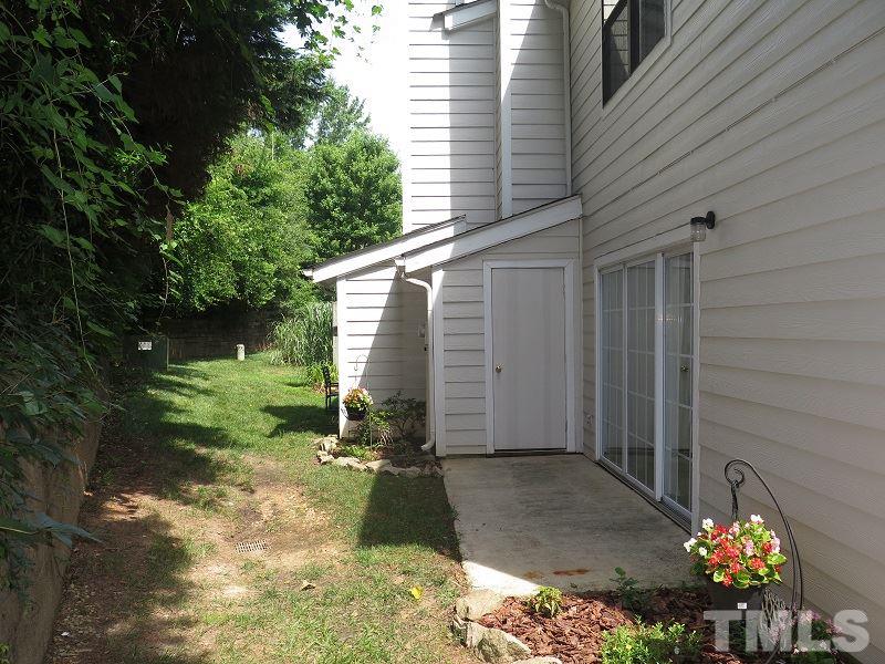 7752 Falcon Rest Circle, Unit 7752 Raleigh, NC 27615 - Photo 17 of 17 a backyard of a house with lots of green space