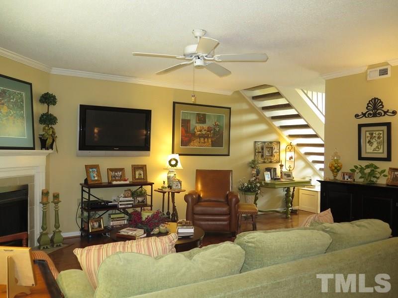 7752 Falcon Rest Circle, Unit 7752 Raleigh, NC 27615 - Photo 5 of 17 a living room with furniture and a flat screen tv