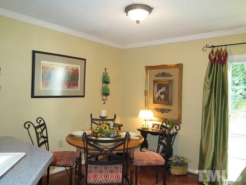 7752 Falcon Rest Circle, Unit 7752 Raleigh, NC 27615 - Photo 6 of 17 a dining room with furniture and window