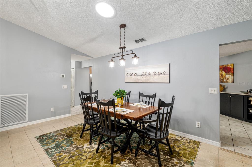 9770 Southwest 97th Place Ocala, FL 34481 - Photo 12 of 64 a view of a dining room with furniture