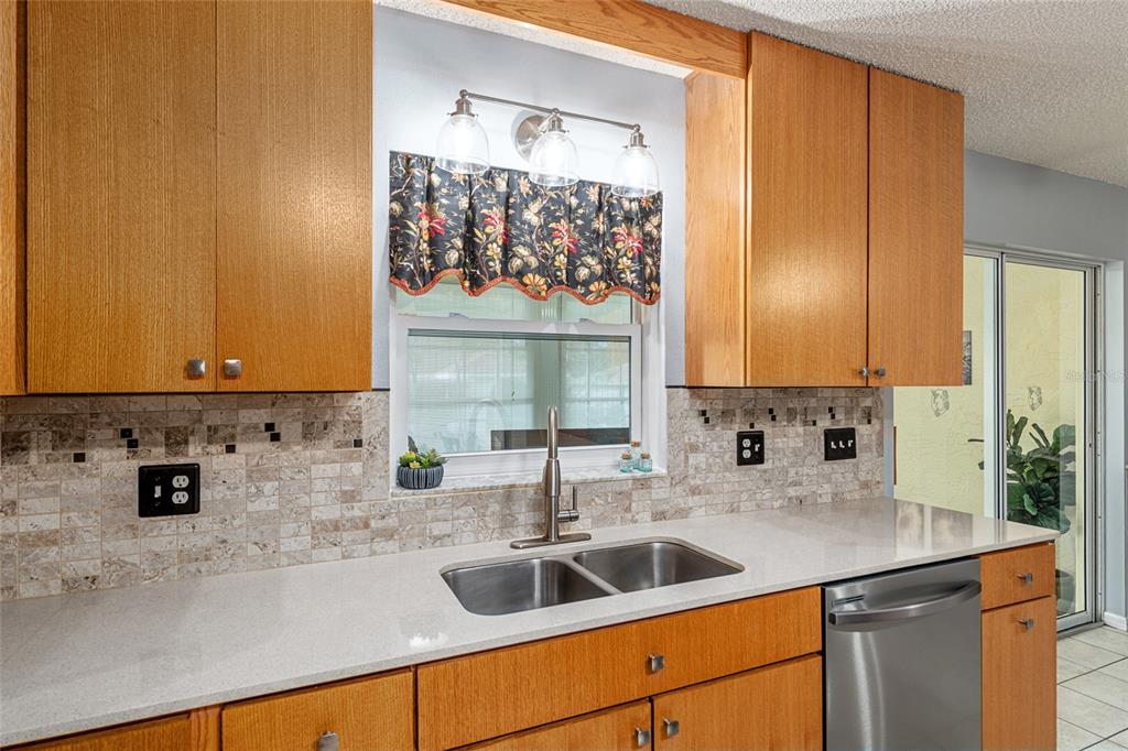 9770 Southwest 97th Place Ocala, FL 34481 - Photo 24 of 64 a kitchen with a sink and cabinets