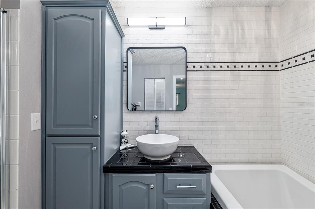 9770 Southwest 97th Place Ocala, FL 34481 - Photo 32 of 64 a bathroom with a sink a toilet and mirror