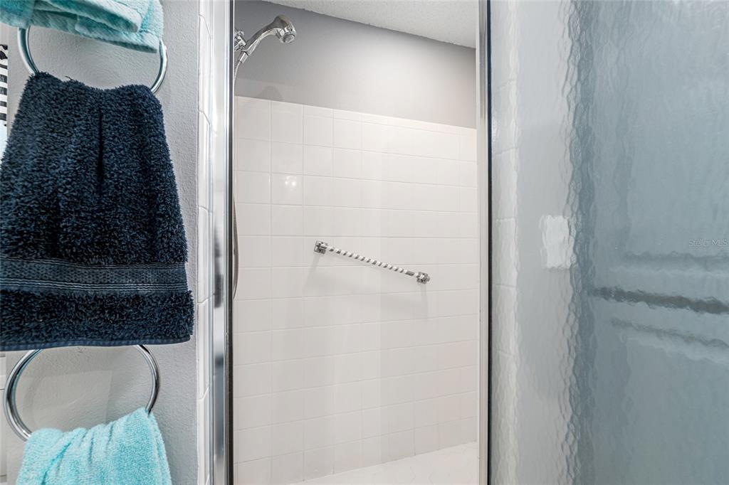 9770 Southwest 97th Place Ocala, FL 34481 - Photo 33 of 64 a bathroom with a bathtub and a shower