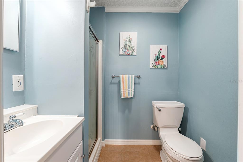 9770 Southwest 97th Place Ocala, FL 34481 - Photo 37 of 64 a white toilet sitting next to a bathroom sink