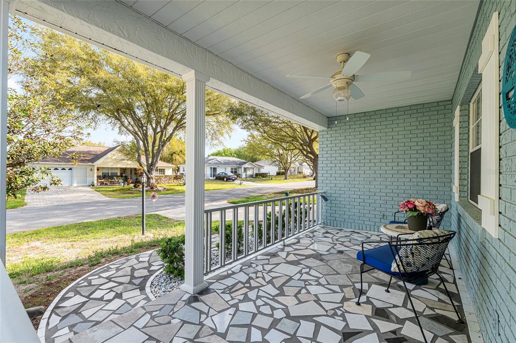 9770 Southwest 97th Place Ocala, FL 34481 - Photo 4 of 64 a view of a porch with furniture and floor to ceiling window