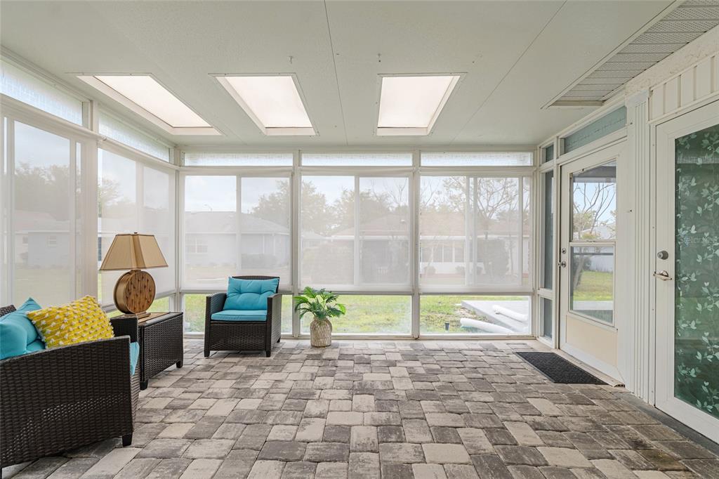 9770 Southwest 97th Place Ocala, FL 34481 - Photo 53 of 64 a view of a livingroom with furniture and floor to ceiling window