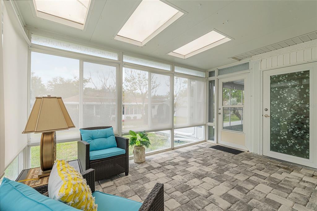 9770 Southwest 97th Place Ocala, FL 34481 - Photo 54 of 64 a living room with furniture and a large window