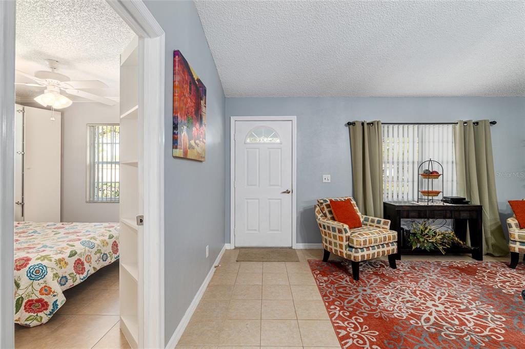 9770 Southwest 97th Place Ocala, FL 34481 - Photo 7 of 64 a living room with furniture and a rug