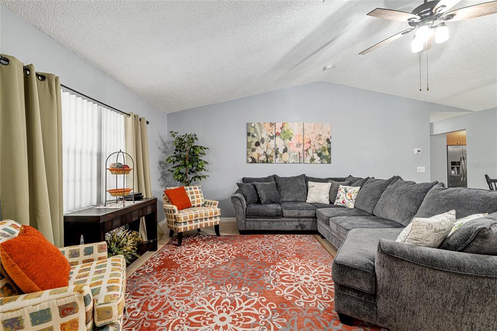 9770 Southwest 97th Place Ocala, FL 34481 - Photo 8 of 64 a living room with furniture and a large window