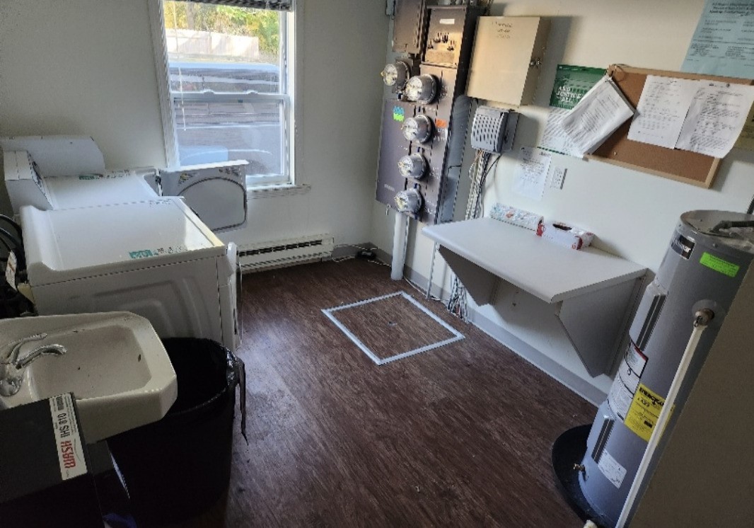 907 South State Street Hart, MI 49420 - Photo 7 of 10 a living room with furniture and a window