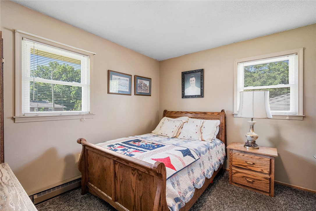 312 Edwards Drive Anderson, SC 29626 - Photo 23 of 44 Two windows naturally illuminate this cozy bedroom, creating a tranquil retreat for rest.