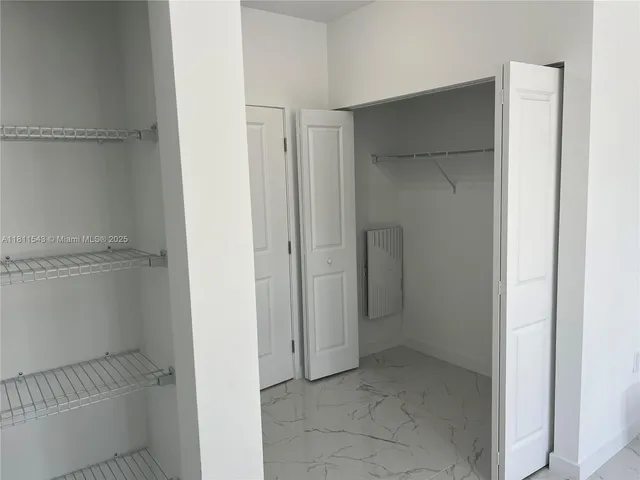 a view of an empty walk in closet